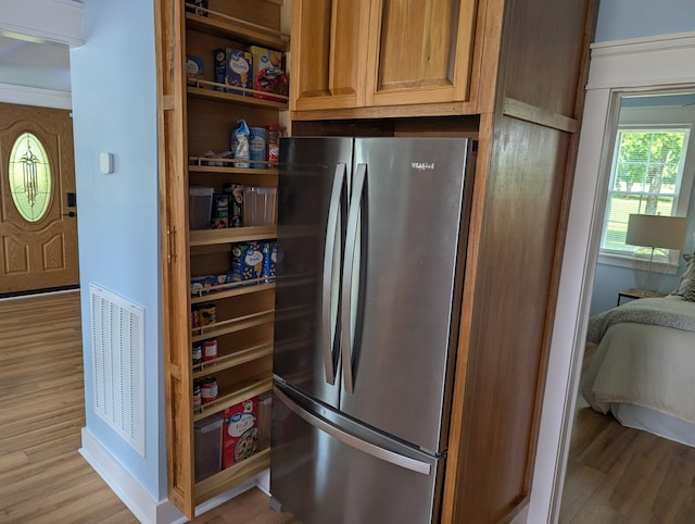 1237 Abiff Rd, Bon Aqua, TN 37025 - kitchen with freestanding refrigerator, light wood-style floors, and open shelves