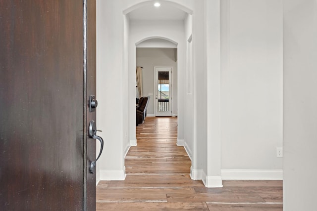 2957 Stewart Campbell Pt, Spring Hill, TN 37174 - corridor featuring arched walkways and light wood-type flooring