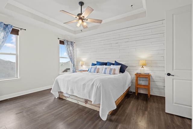 2957 Stewart Campbell Pt, Spring Hill, TN 37174 - bedroom with a tray ceiling, multiple windows, dark wood-style floors, ornamental molding, and a ceiling fan