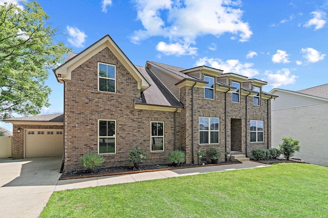 2957 Stewart Campbell Pt, Spring Hill, TN 37174 - view of front facade with concrete driveway, an attached garage, a front yard, and brick siding