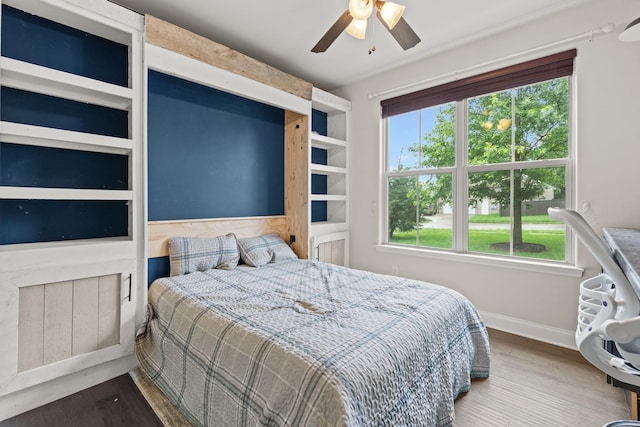 2957 Stewart Campbell Pt, Spring Hill, TN 37174 - bedroom featuring multiple windows, wood finished floors, and a ceiling fan