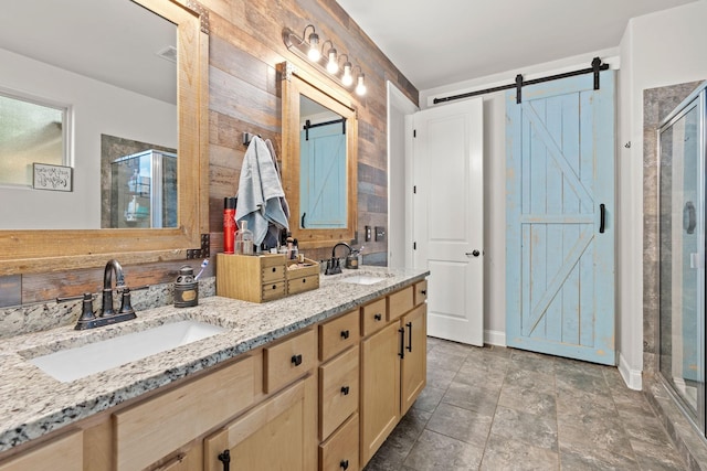 2957 Stewart Campbell Pt, Spring Hill, TN 37174 - full bath featuring a stall shower, double vanity, stone finish floors, and wood walls