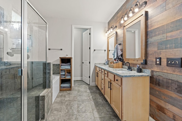2957 Stewart Campbell Pt, Spring Hill, TN 37174 - bathroom with double vanity, a shower stall, stone finish floors, a bath, and wood walls