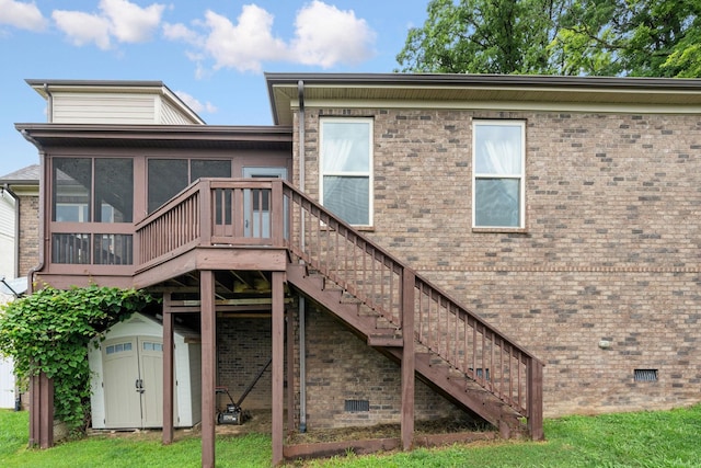 2957 Stewart Campbell Pt, Spring Hill, TN 37174 - back of house featuring crawl space, stairs, a sunroom, and a storage unit