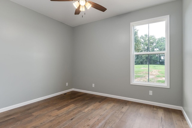 1554 Duncans Chapel Rd, Cookeville, TN 38506 - unfurnished room with plenty of natural light, a ceiling fan, and dark wood finished floors