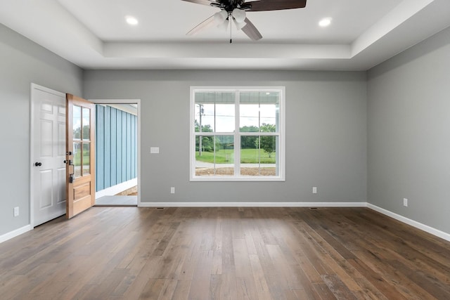 1554 Duncans Chapel Rd, Cookeville, TN 38506 - spare room featuring a raised ceiling, plenty of natural light, dark wood-style floors, and recessed lighting