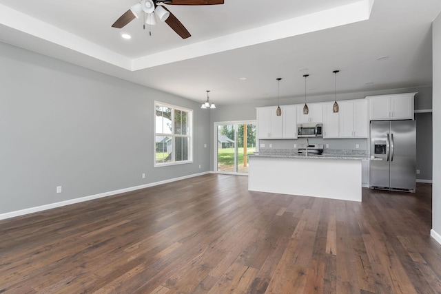 1554 Duncans Chapel Rd, Cookeville, TN 38506 - kitchen featuring appliances with stainless steel finishes, dark wood-type flooring, white cabinetry, a ceiling fan, and a center island with sink