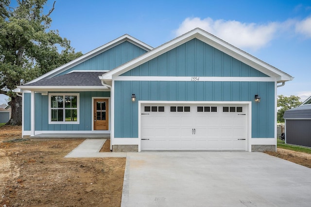 1554 Duncans Chapel Rd, Cookeville, TN 38506 - single story home featuring a garage, concrete driveway, board and batten siding, and roof with shingles