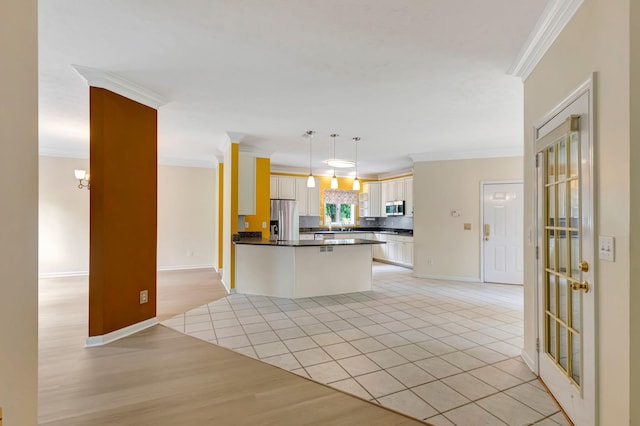 822 Old Jefferson Pike, Smyrna, TN 37167 - kitchen with stainless steel appliances, crown molding, dark countertops, open floor plan, and light tile patterned floors