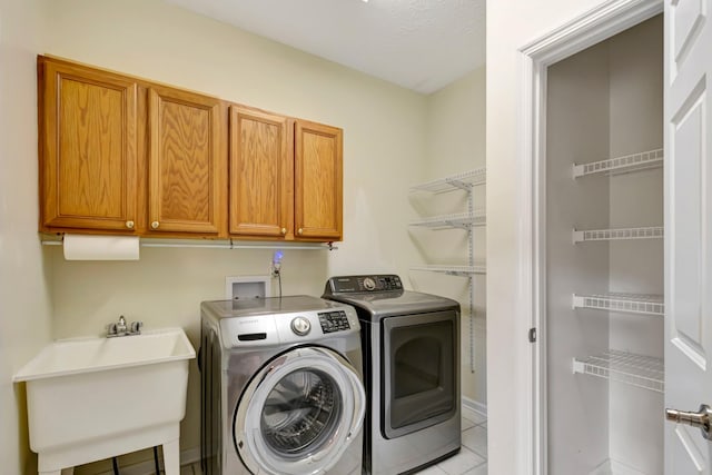 822 Old Jefferson Pike, Smyrna, TN 37167 - laundry room with washer and dryer, light tile patterned flooring, and cabinet space