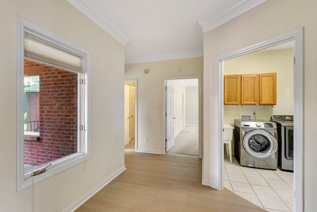 822 Old Jefferson Pike, Smyrna, TN 37167 - laundry room featuring ornamental molding, independent washer and dryer, cabinet space, and light wood-style flooring