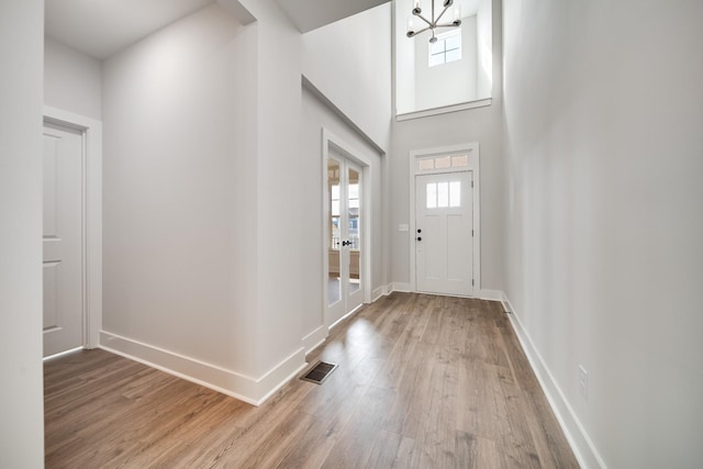7274 Fairlawn Dr, Fairview, TN 37062 - foyer entrance featuring wood finished floors, a chandelier, and a high ceiling
