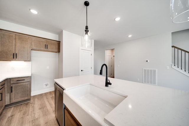 7274 Fairlawn Dr, Fairview, TN 37062 - kitchen with dishwasher, light countertops, light wood-style floors, and recessed lighting