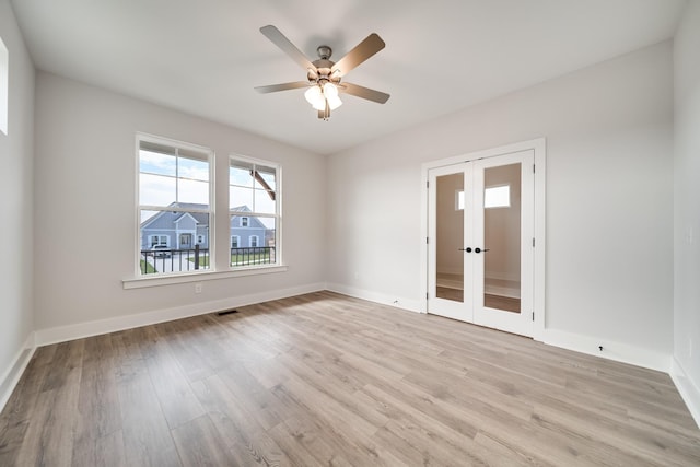 7274 Fairlawn Dr, Fairview, TN 37062 - empty room featuring french doors, light wood-style floors, and a ceiling fan