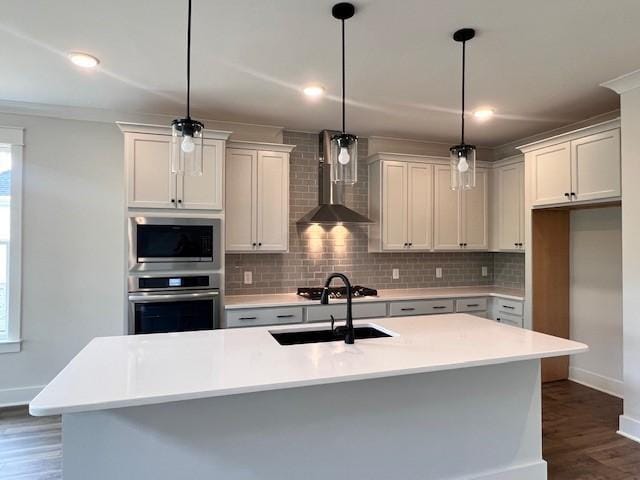 7274 Fairlawn Dr, Fairview, TN 37062 - kitchen featuring appliances with stainless steel finishes, decorative backsplash, dark wood-type flooring, wall chimney exhaust hood, and light countertops