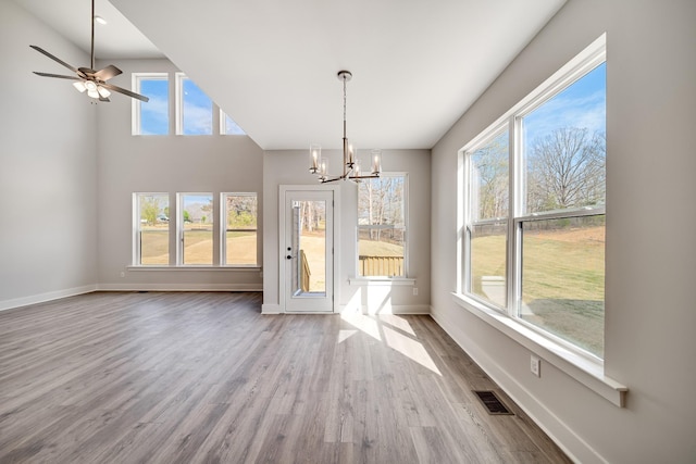 7274 Fairlawn Dr, Fairview, TN 37062 - unfurnished dining area featuring a chandelier, wood finished floors, and a ceiling fan