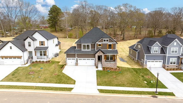 7274 Fairlawn Dr, Fairview, TN 37062 - view of front facade with driveway, board and batten siding, a porch, a front yard, and stone siding
