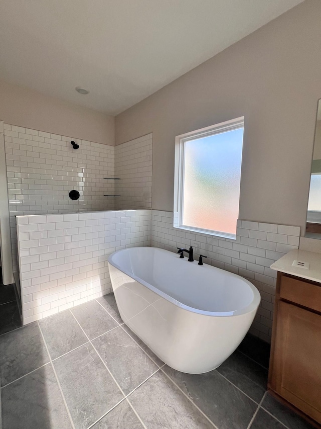 7274 Fairlawn Dr, Fairview, TN 37062 - bathroom with tile walls, tile patterned flooring, vanity, a freestanding bath, and a tile shower