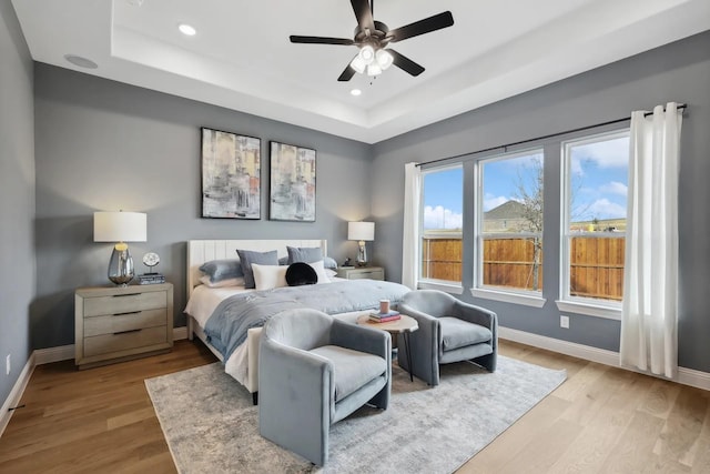 7235 Fairlawn Dr, Fairview, TN 37062 - bedroom featuring a tray ceiling, light wood-style flooring, recessed lighting, and a ceiling fan