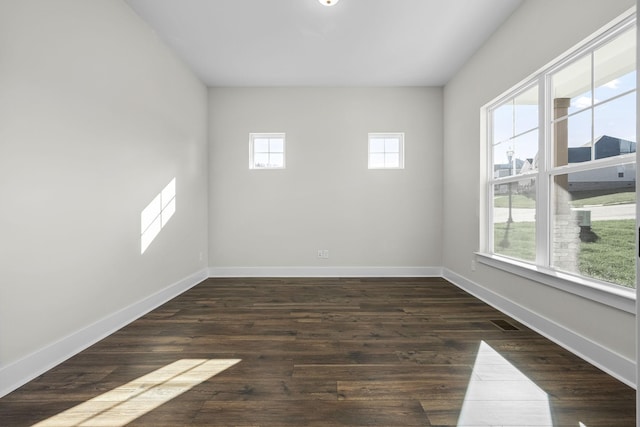 7253 Fairlawn Dr, Fairview, TN 37062 - empty room featuring healthy amount of natural light and dark wood-style flooring