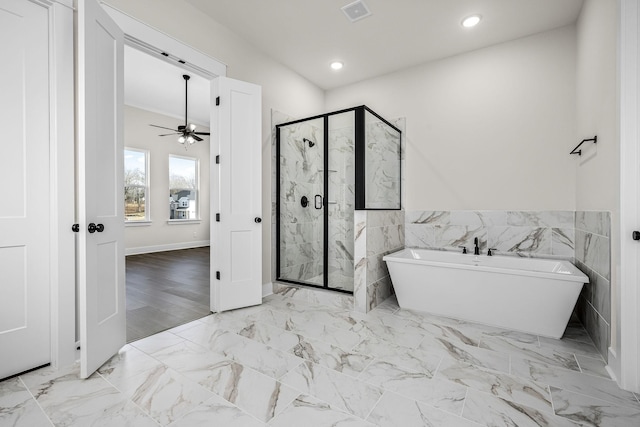 7253 Fairlawn Dr, Fairview, TN 37062 - full bath with a soaking tub, a marble finish shower, ceiling fan, recessed lighting, and tile walls