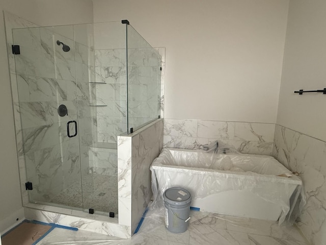 7253 Fairlawn Dr, Fairview, TN 37062 - bathroom with a tub with marble appearance, a marble finish shower, and marble look tile flooring