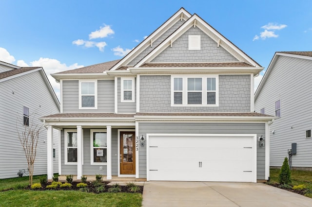 665 Conifer Dr, Spring Hill, TN 37174 - view of front of house featuring driveway, covered porch, a garage, and a shingled roof
