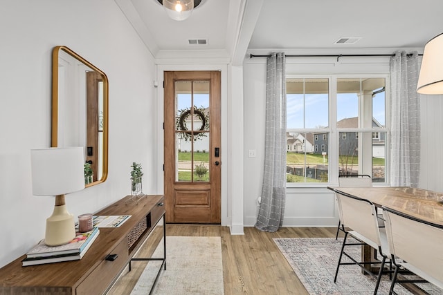 665 Conifer Dr, Spring Hill, TN 37174 - entryway featuring light wood finished floors and crown molding
