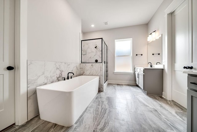 7267 Fairlawn Dr, Fairview, TN 37062 - full bath with vanity, a soaking tub, a stall shower, marble finish flooring, and tile walls