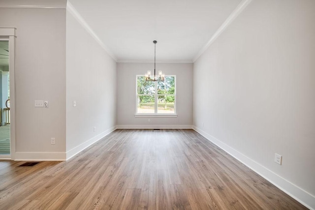 7267 Fairlawn Dr, Fairview, TN 37062 - empty room featuring a chandelier, crown molding, and wood finished floors