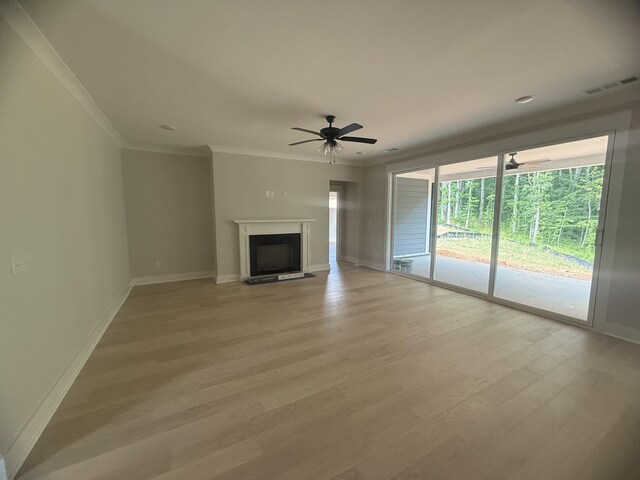 7267 Fairlawn Dr, Fairview, TN 37062 - unfurnished living room with a ceiling fan, crown molding, light wood-type flooring, and a fireplace