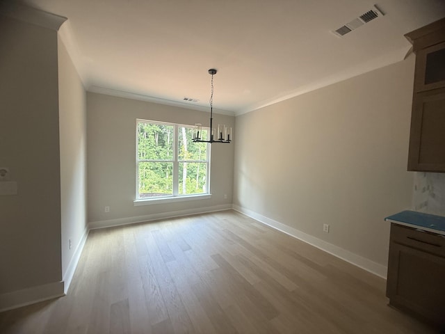 7267 Fairlawn Dr, Fairview, TN 37062 - unfurnished dining area with light wood finished floors, a chandelier, and crown molding
