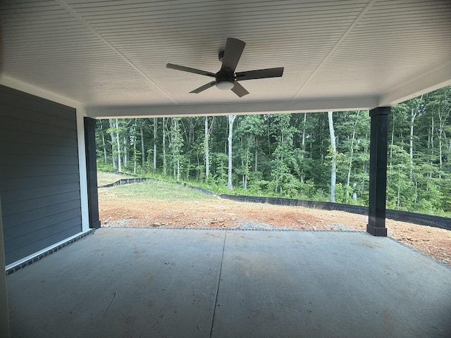 7267 Fairlawn Dr, Fairview, TN 37062 - view of patio with ceiling fan, a view of trees, and an attached carport