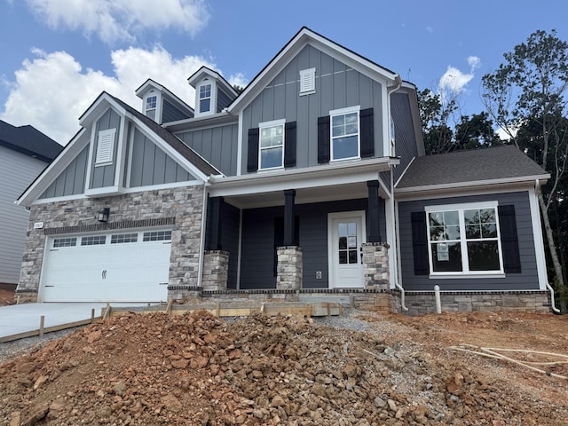 7267 Fairlawn Dr, Fairview, TN 37062 - craftsman inspired home with a porch, board and batten siding, concrete driveway, an attached garage, and stone siding
