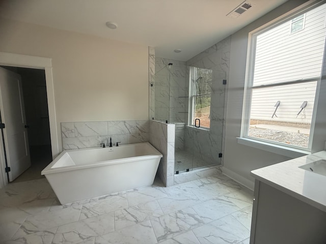 7267 Fairlawn Dr, Fairview, TN 37062 - bathroom featuring marble finish floors, a soaking tub, vanity, and a marble finish shower