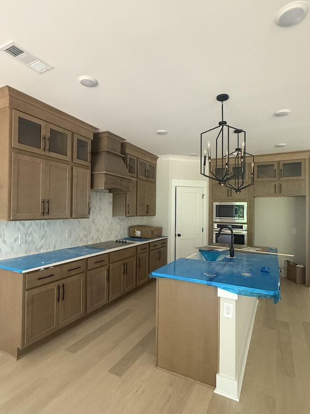 7267 Fairlawn Dr, Fairview, TN 37062 - kitchen featuring premium range hood, stainless steel appliances, a chandelier, light wood-style flooring, and recessed lighting