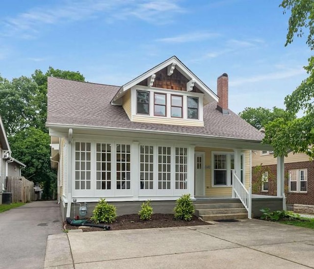 162 Woodmont Blvd, Nashville, TN 37205 - view of front facade with covered porch, a chimney, roof with shingles, and concrete driveway