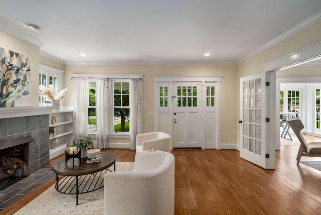162 Woodmont Blvd, Nashville, TN 37205 - living room featuring wood finished floors, a tile fireplace, ornamental molding, french doors, and recessed lighting