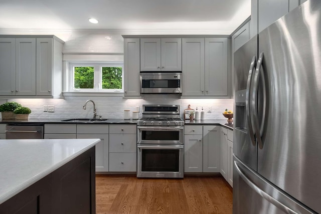 162 Woodmont Blvd, Nashville, TN 37205 - kitchen with appliances with stainless steel finishes, wood finished floors, tasteful backsplash, gray cabinets, and recessed lighting