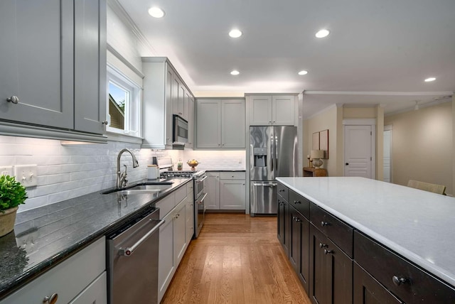 162 Woodmont Blvd, Nashville, TN 37205 - kitchen featuring stainless steel appliances, tasteful backsplash, recessed lighting, light wood-type flooring, and dark stone counters