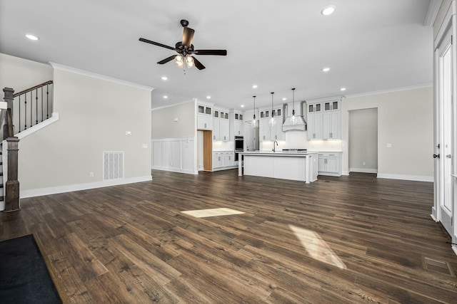 7263 Fairlawn Dr, Fairview, TN 37062 - unfurnished living room with a ceiling fan, dark wood-style floors, recessed lighting, ornamental molding, and stairs