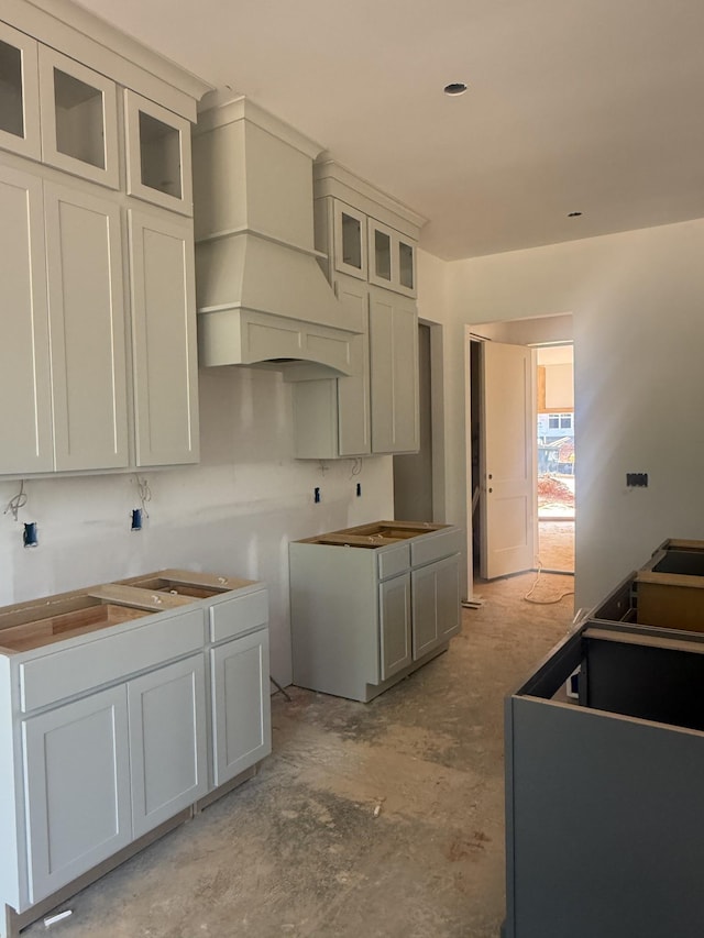 7266 Fairlawn Dr, Fairview, TN 37062 - kitchen with custom range hood and glass insert cabinets