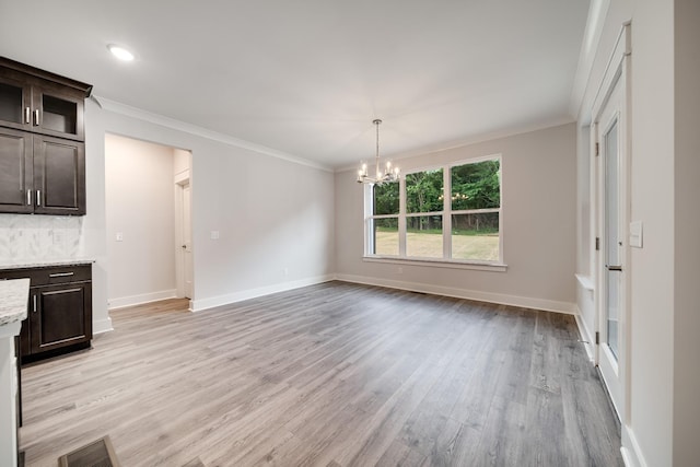 7266 Fairlawn Dr, Fairview, TN 37062 - unfurnished dining area with light wood-type flooring, a chandelier, and ornamental molding