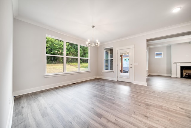 7266 Fairlawn Dr, Fairview, TN 37062 - unfurnished dining area with a chandelier, ornamental molding, light wood finished floors, and a fireplace