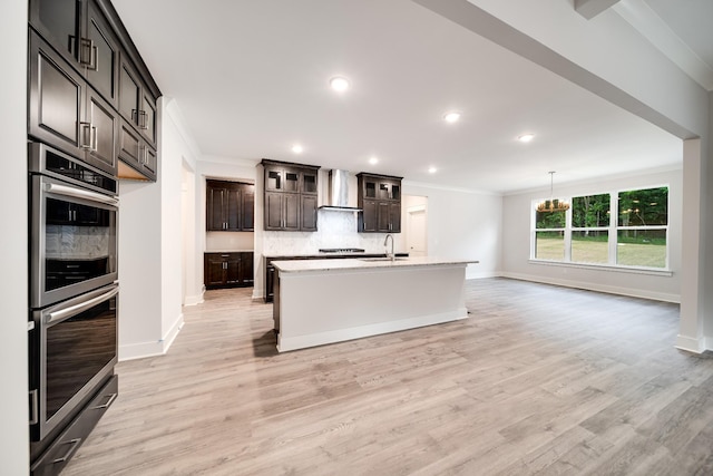 7266 Fairlawn Dr, Fairview, TN 37062 - kitchen with double oven, crown molding, wall chimney exhaust hood, tasteful backsplash, and light wood-type flooring