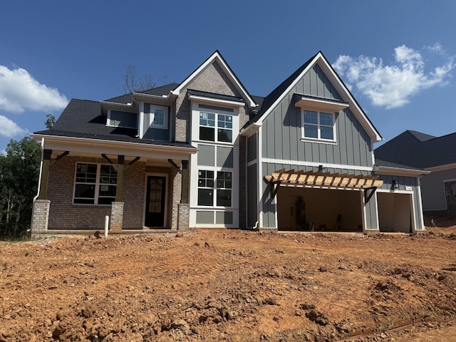 7266 Fairlawn Dr, Fairview, TN 37062 - view of front of house with board and batten siding, brick siding, and a garage