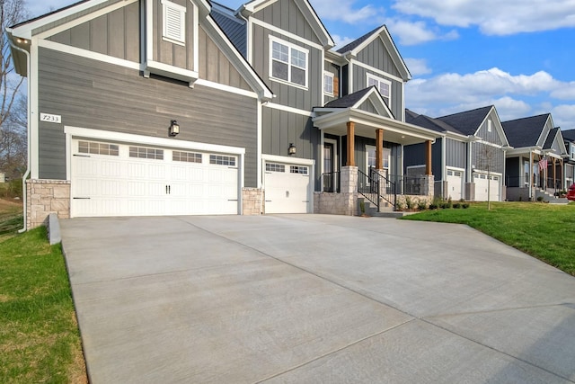 7233 Richvale Dr W, Fairview, TN 37062 - craftsman-style home with board and batten siding, stone siding, driveway, and a front yard