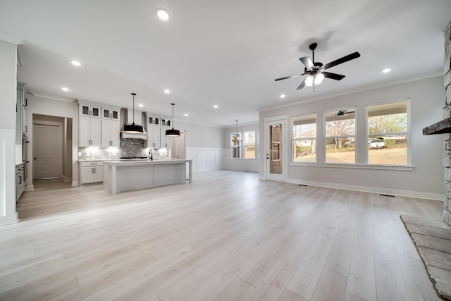7233 Richvale Dr W, Fairview, TN 37062 - unfurnished living room with ornamental molding, recessed lighting, a ceiling fan, light wood-style flooring, and a fireplace