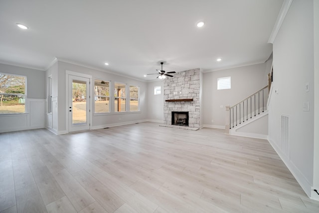 7233 Richvale Dr W, Fairview, TN 37062 - unfurnished living room with ceiling fan, crown molding, light wood-style floors, stairway, and a fireplace