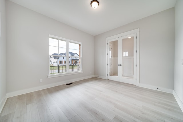 7233 Richvale Dr W, Fairview, TN 37062 - unfurnished room featuring light wood-style floors and french doors